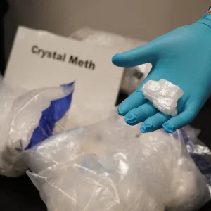 Crystal meth showing clear, shard-like crystalline structures resembling glass fragments.